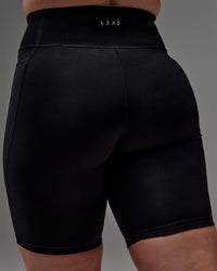 Woman wearing Fusion Ultra High-Rise 9" Short Pockets - Black | Model:Caity | Size:M | Thumbnail Index: 30