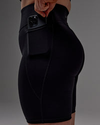 Woman wearing Fusion Ultra High-Rise 9" Short Pockets - Black | Model:Caity | Size:M | Thumbnail Index: 26