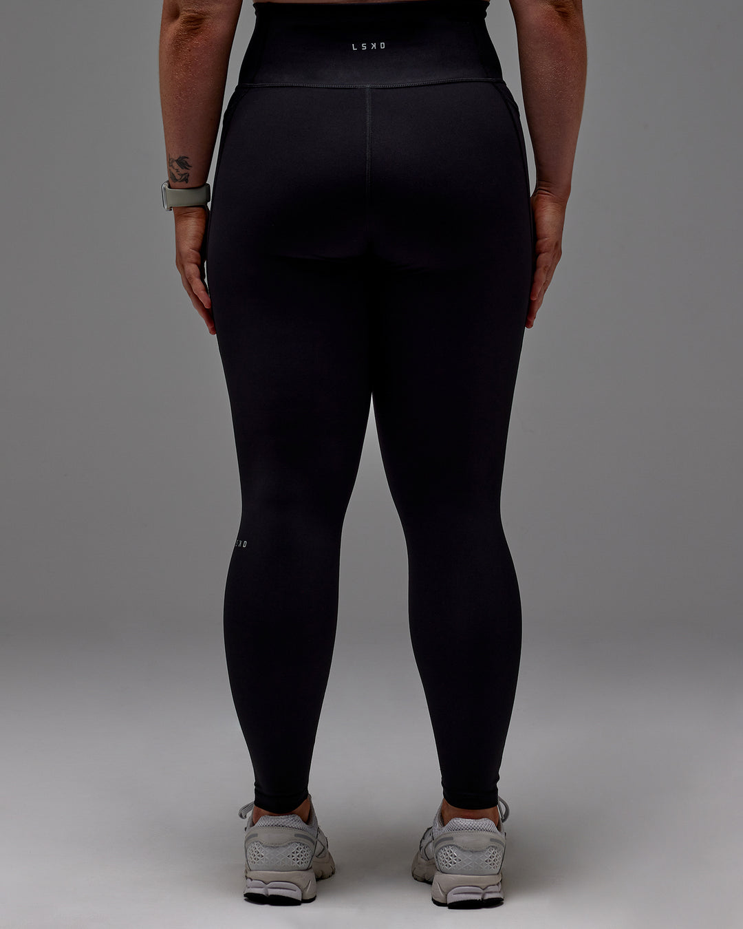 Woman wearing Fusion Ultra High-Rise Full Length Legging Pockets - Black | Model:Caity | Size:M - view 26