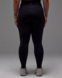 Woman wearing Fusion Ultra High-Rise Full Length Legging Pockets - Black | Model:Caity | Size:M | Thumbnail Index: 25