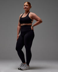 Woman wearing Fusion Ultra High-Rise Full Length Legging Pockets - Black | Model:Caity | Size:M | Thumbnail Index: 28