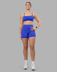 Woman wearing Fusion Ultra High-Rise 4" Short Pockets - Power Cobalt | Model:Amy | Size:M | Thumbnail Index: 2