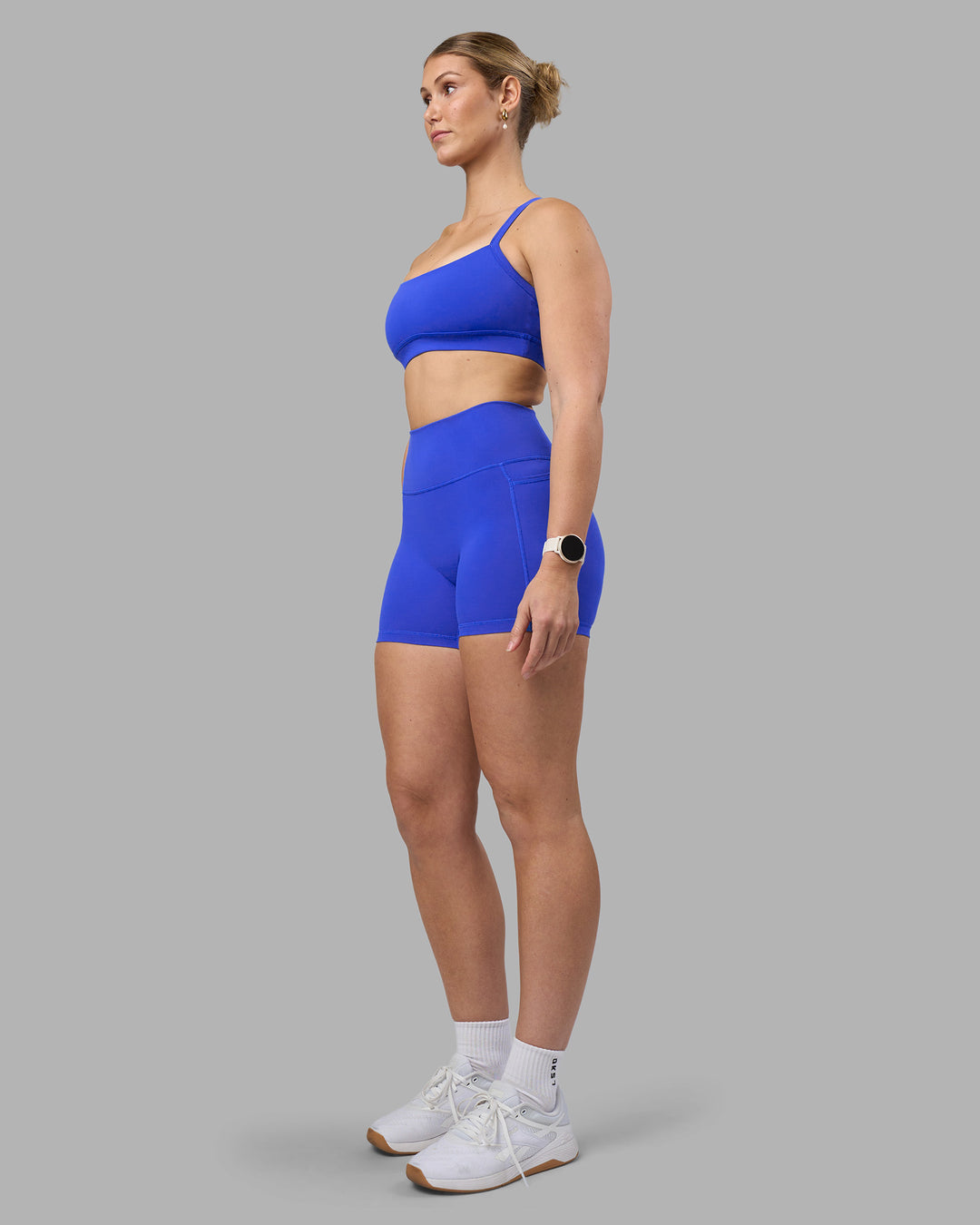 Woman wearing Fusion Ultra High-Rise 4" Short Pockets - Power Cobalt | Model:Amy | Size:M - view 8
