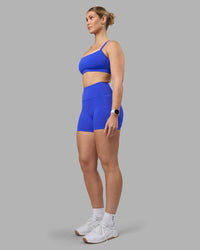 Woman wearing Fusion Ultra High-Rise 4" Short Pockets - Power Cobalt | Model:Amy | Size:M | Thumbnail Index: 7