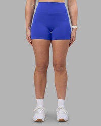 Woman wearing Fusion Ultra High-Rise 4" Short - Power Cobalt | Set:true | Angle:front | Model:Amy | Size:M | Thumbnail Index: 1