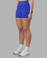 Woman wearing Fusion Ultra High-Rise 4" Short - Power Cobalt | Set:true | Angle:side | Model:Amy | Size:M | Thumbnail Index: 6