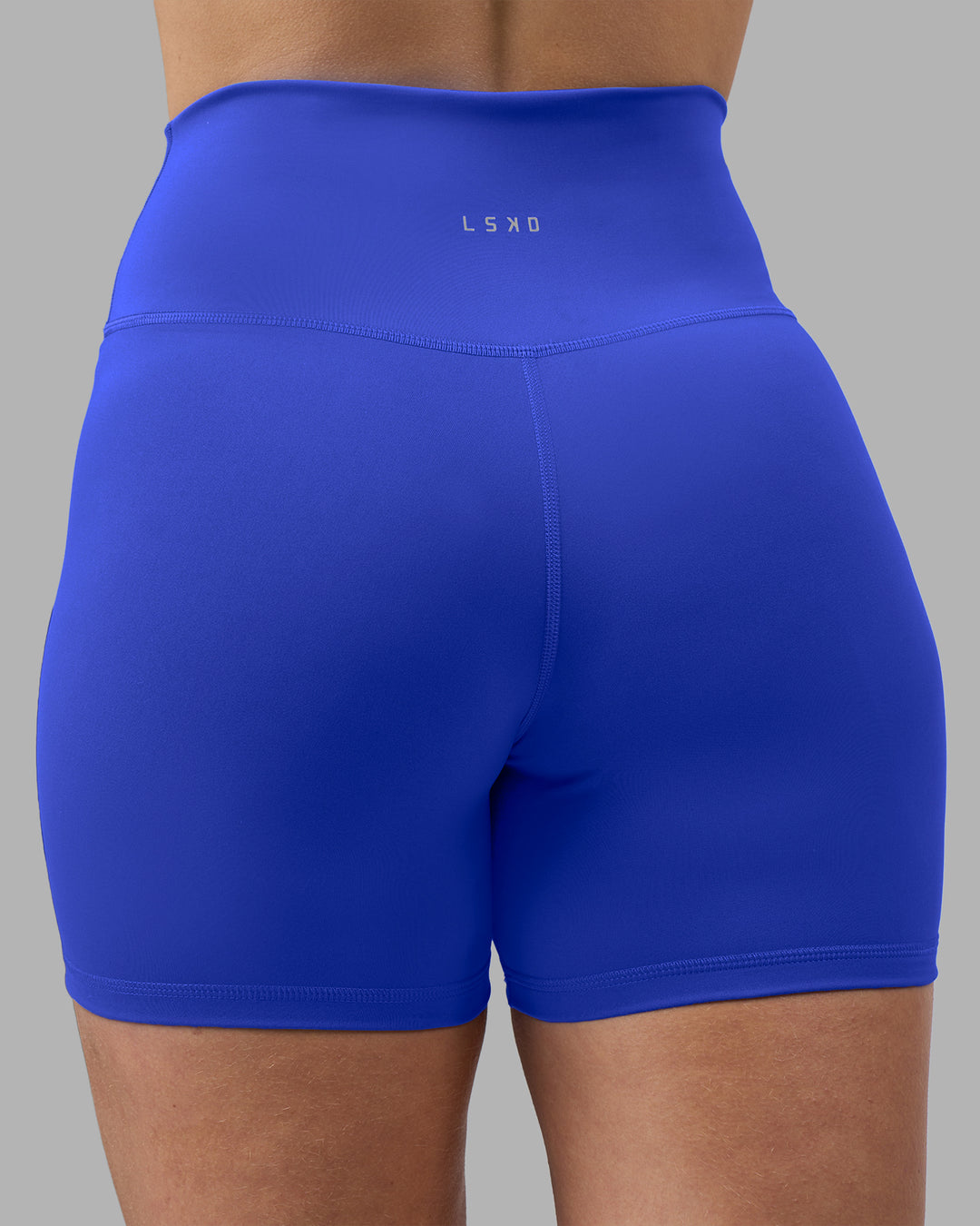 Woman wearing Fusion Ultra High-Rise 4" Short - Power Cobalt | Model:Amy | Size:M - view 8