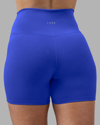 Woman wearing Fusion Ultra High-Rise 4" Short - Power Cobalt | Model:Amy | Size:M | Thumbnail Index: 7