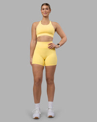 Woman wearing Fusion Ultra High-Rise 6" Short Pockets - Lemon | Model:Amy | Size:M | Thumbnail Index: 0