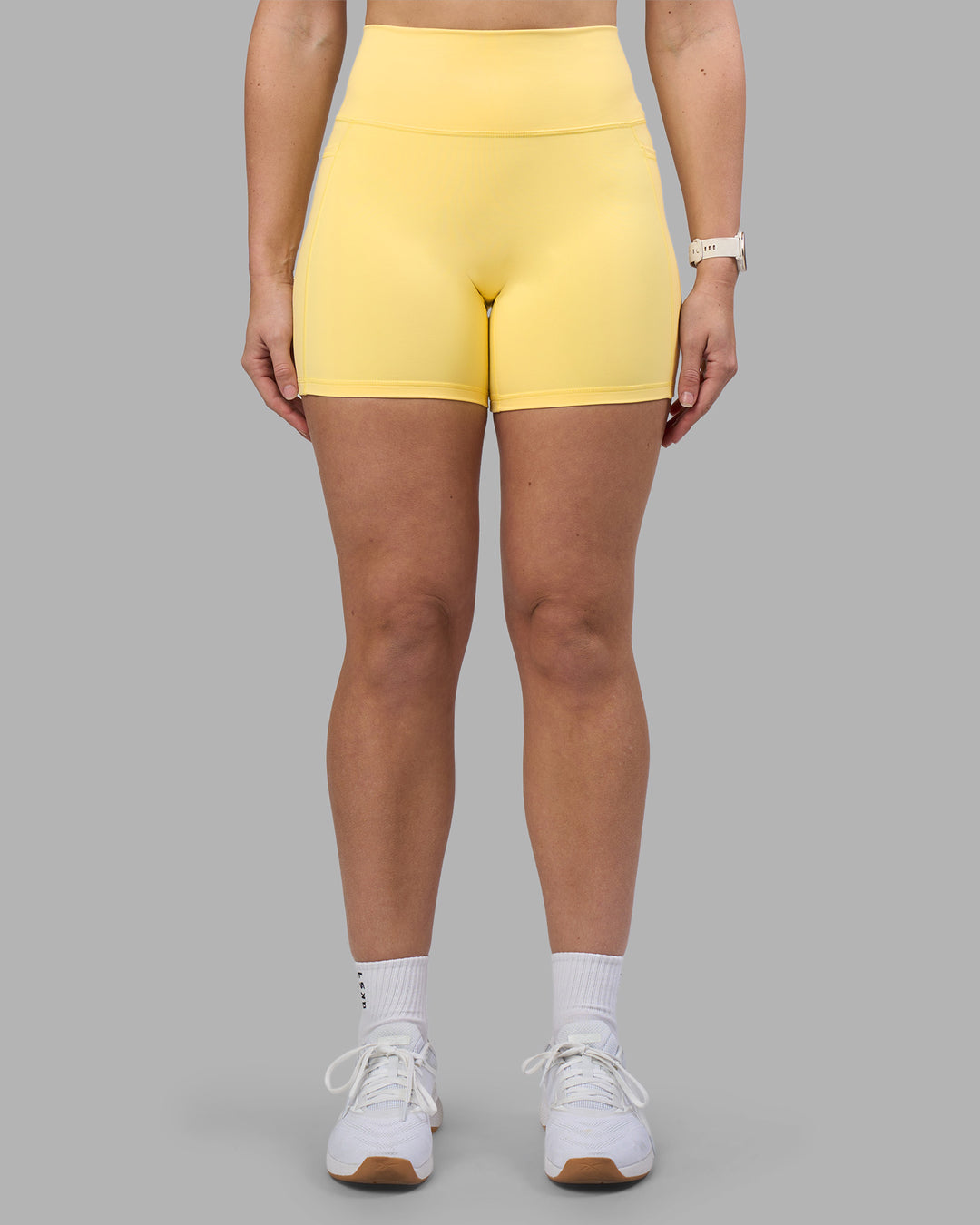 Woman wearing Fusion Ultra High-Rise 6" Short Pockets - Lemon | Model:Amy | Size:M - view 2