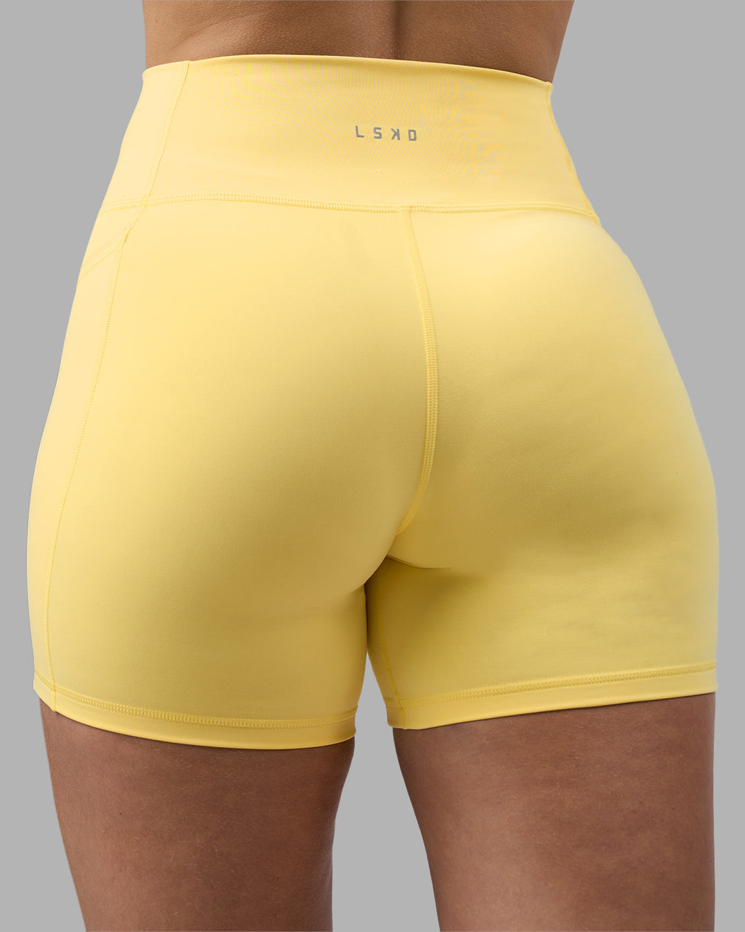 Woman wearing Fusion Ultra High-Rise 6" Short Pockets - Lemon | Model:Amy | Size:M - view 8