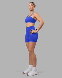 Woman wearing Fusion Ultra High-Rise 6" Short Pockets - Power Cobalt | Model:Amy | Size:M | Thumbnail Index: 2