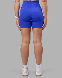 Woman wearing Fusion Ultra High-Rise 6" Short Pockets - Power Cobalt | Set:true | Angle:back | Model:Amy | Size:M | Thumbnail Index: 4