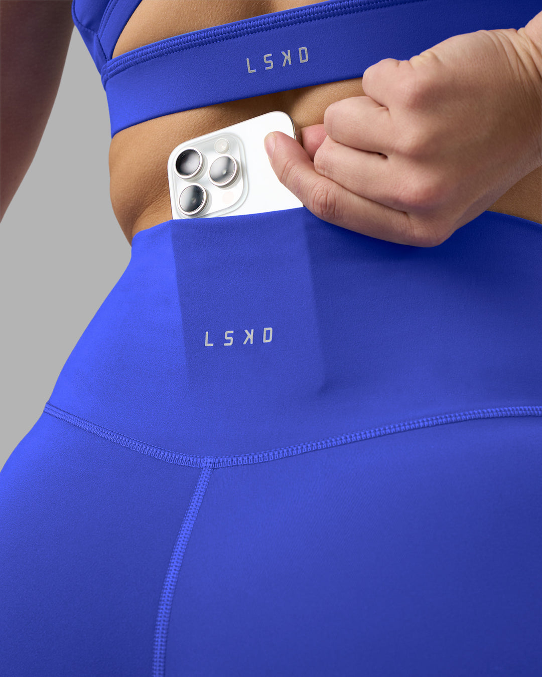 Woman wearing Fusion Ultra High-Rise 6" Short - Power Cobalt | Set:true | Angle:closeup | Model:Amy | Size:M - view 6