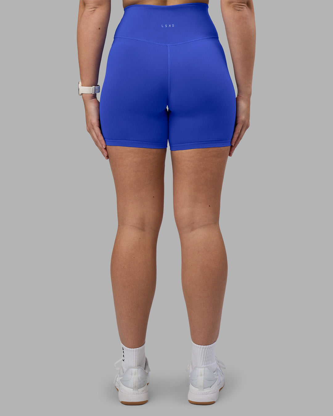 Woman wearing Fusion Ultra High-Rise 6" Short - Power Cobalt | Set:true | Angle:back | Model:Amy | Size:M - view 4