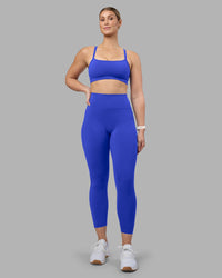 Woman wearing Fusion Ultra High-Rise 7/8 Legging Pockets - Power Cobalt | Model:Amy | Size:M | Thumbnail Index: 1