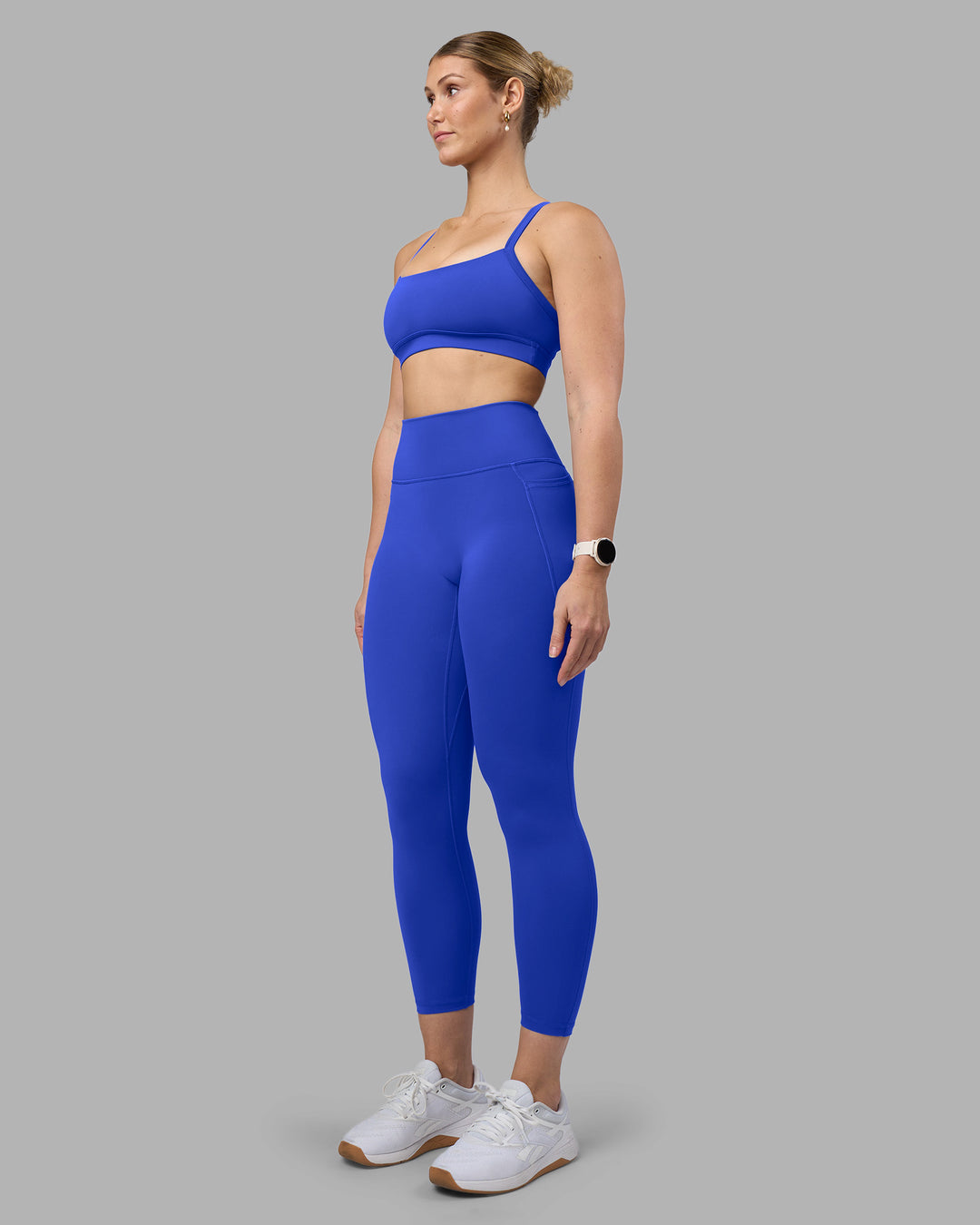 Woman wearing Fusion Ultra High-Rise 7/8 Legging Pockets - Power Cobalt | Model:Amy | Size:M - view 5