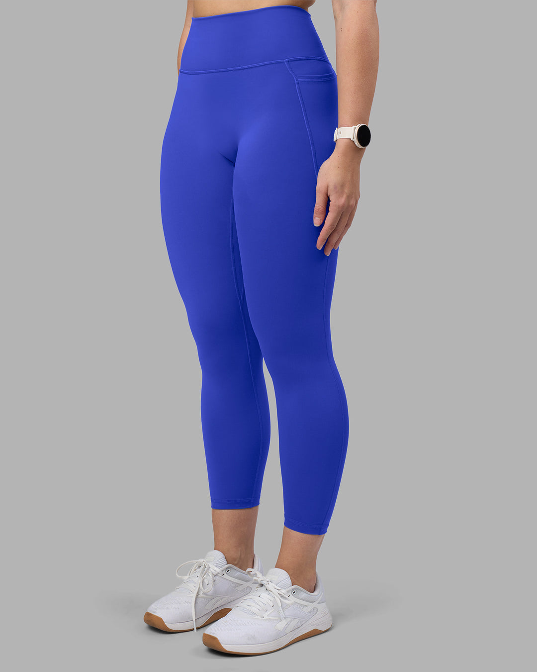 Woman wearing Fusion Ultra High-Rise 7/8 Legging Pockets - Power Cobalt | Model:Amy | Size:M - view 1