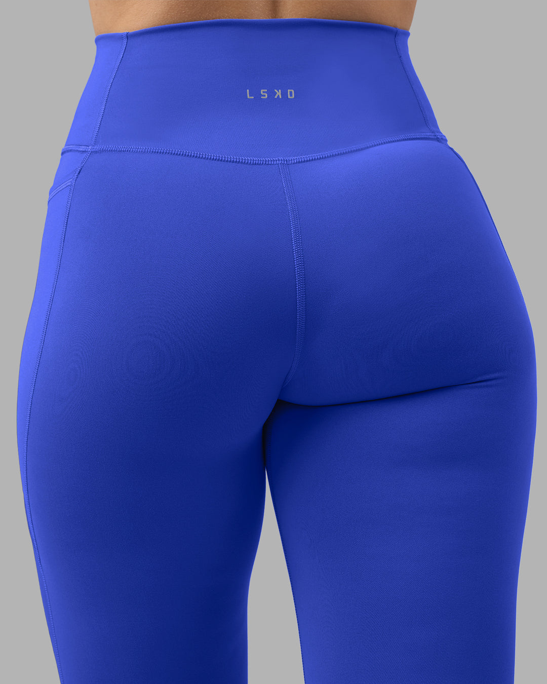 Woman wearing Fusion Ultra High-Rise 7/8 Legging Pockets - Power Cobalt | Model:Amy | Size:M - view 8