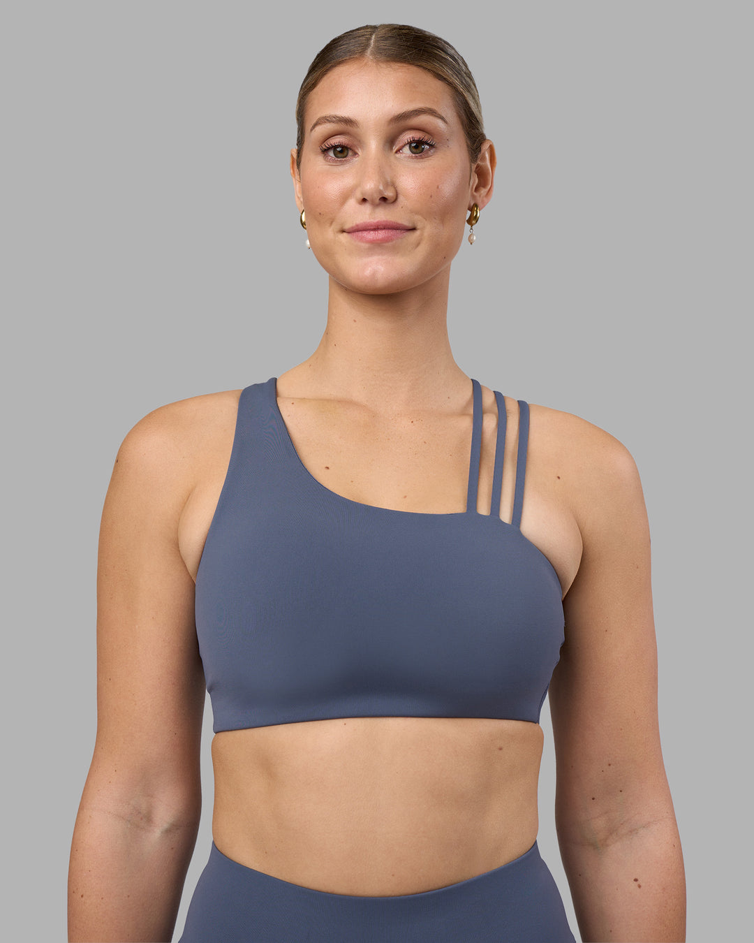 Woman wearing Galvanise Sports Bra 2.0 - Night Shadow | Set:true | Angle:front | Model:Amy | Size:M - view 2