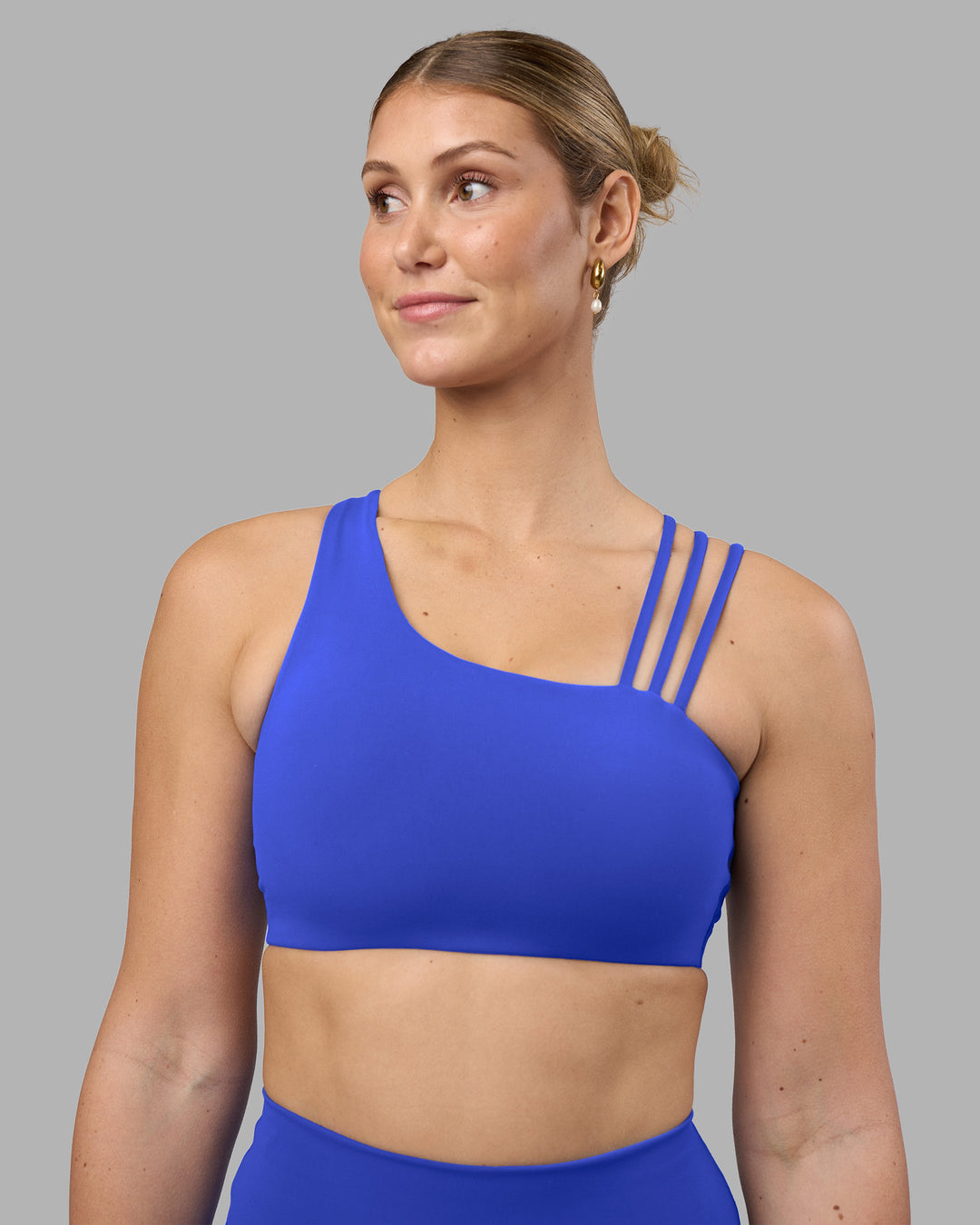 Woman wearing Galvanise Sports Bra 2.0 - Power Cobalt | Set:true | Angle:front | Model:Amy | Size:M - view 1