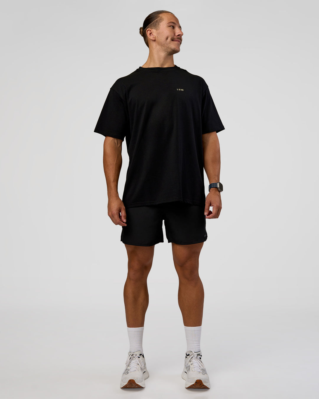 Man wearing High Run FLXCotton Oversized Tee - Black-Yellow Fizz | Model:Jaiden | Size:M - view 9