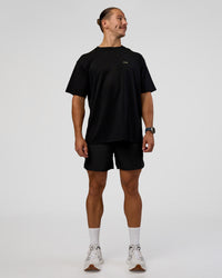 Man wearing High Run FLXCotton Oversized Tee - Black-Yellow Fizz | Model:Jaiden | Size:M | Thumbnail Index: 8