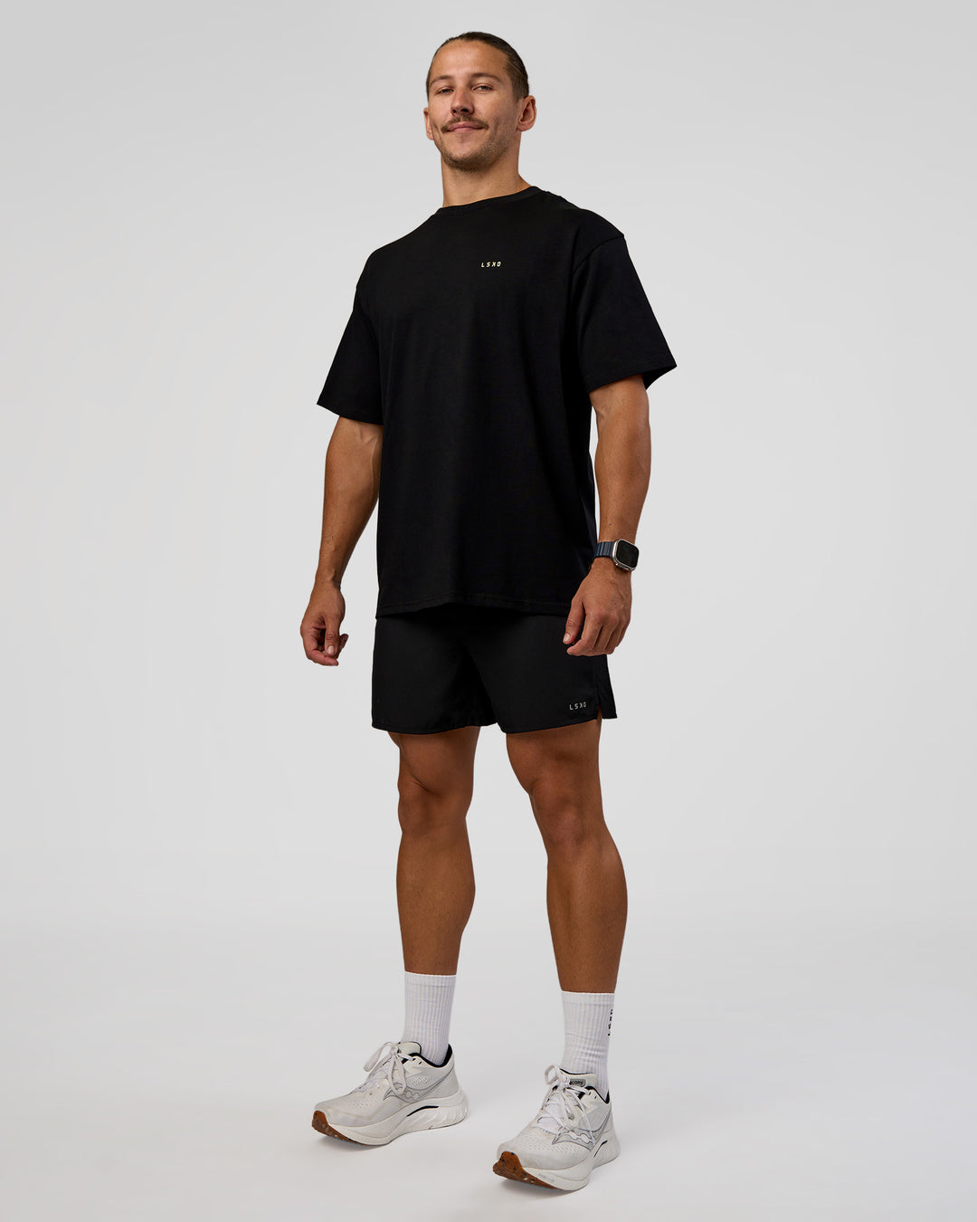 Man wearing High Run FLXCotton Oversized Tee - Black-Yellow Fizz | Model:Jaiden | Size:M - view 6