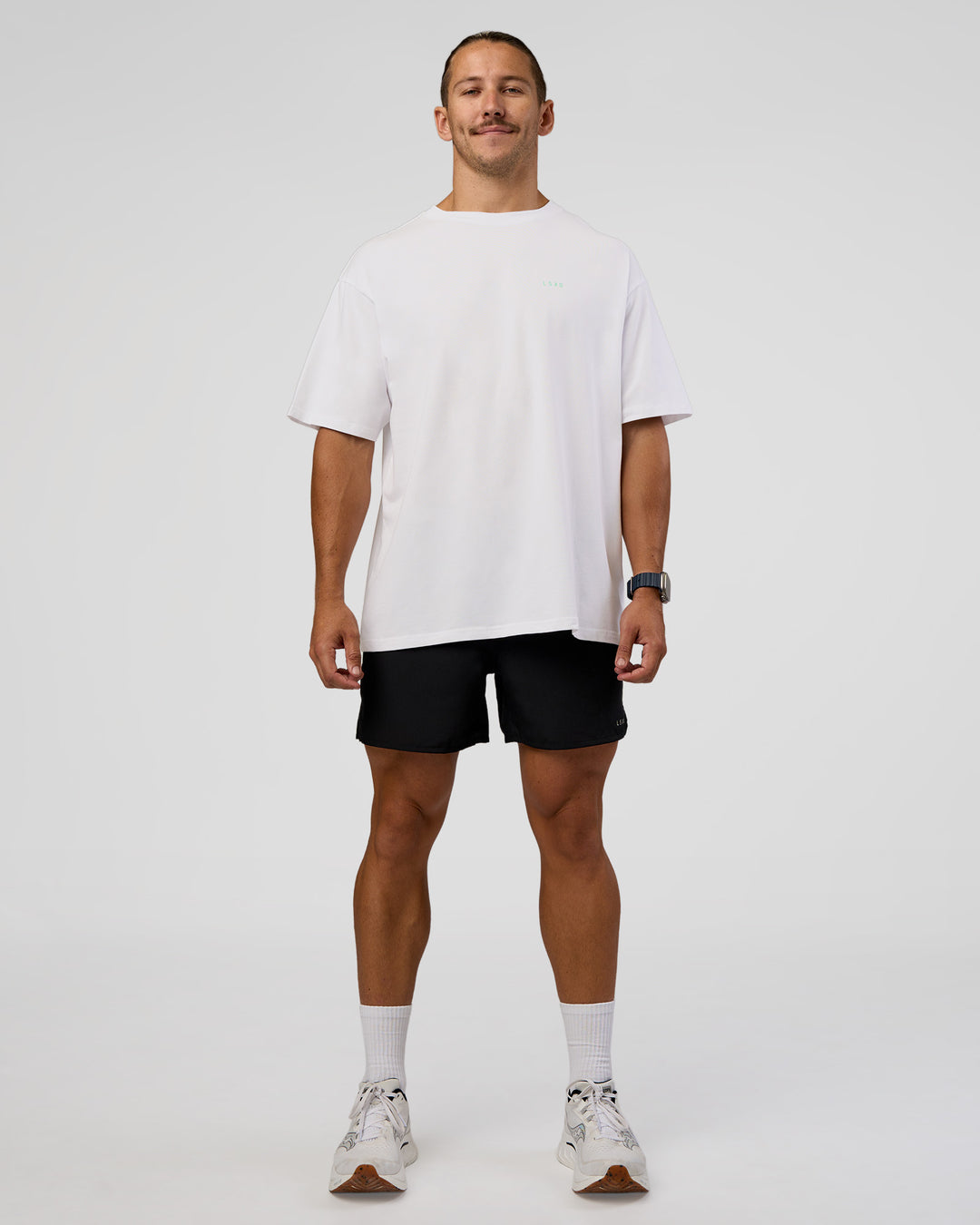 Man wearing High Run FLXCotton Oversized Tee - White-Jelly Mint | Model:Jaiden | Size:M - view 10