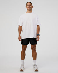Man wearing High Run FLXCotton Oversized Tee - White-Jelly Mint | Model:Jaiden | Size:M | Thumbnail Index: 9
