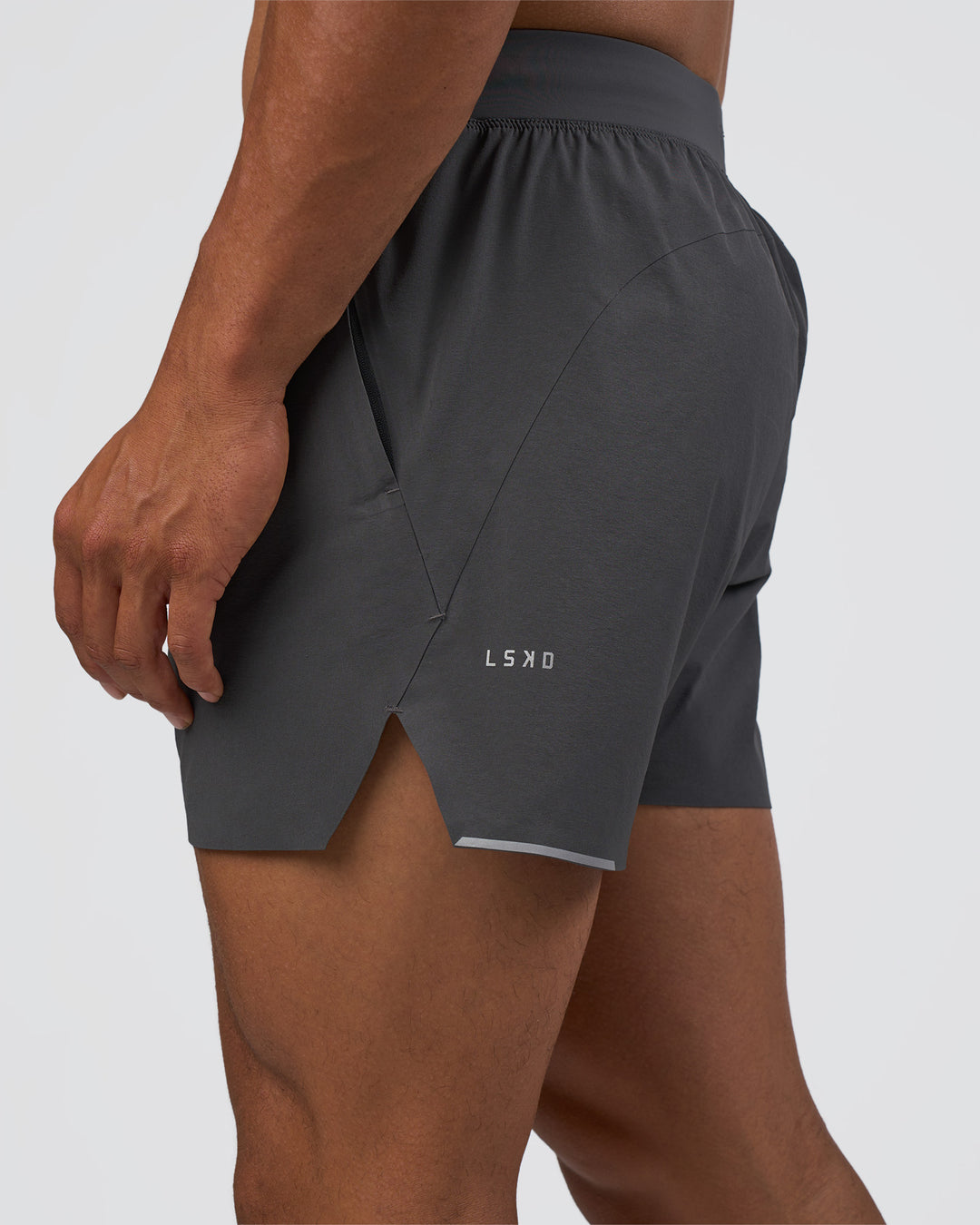 Man wearing Hybrid 5" Short - Dark Storm | Model:Daarian | Size:M - view 1