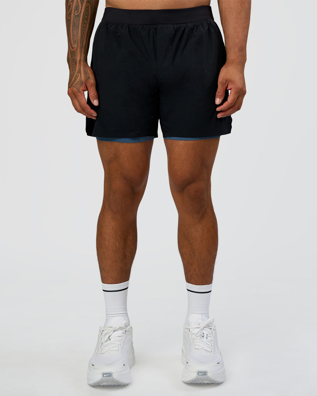 Man wearing Hybrid Lined 5" Short - Black-Indigo | Model:Daarian | Size:M - view 1