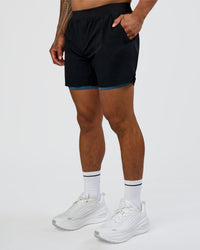 Man wearing Hybrid Lined 5" Short - Black-Indigo | Model:Daarian | Size:M | Thumbnail Index: 7