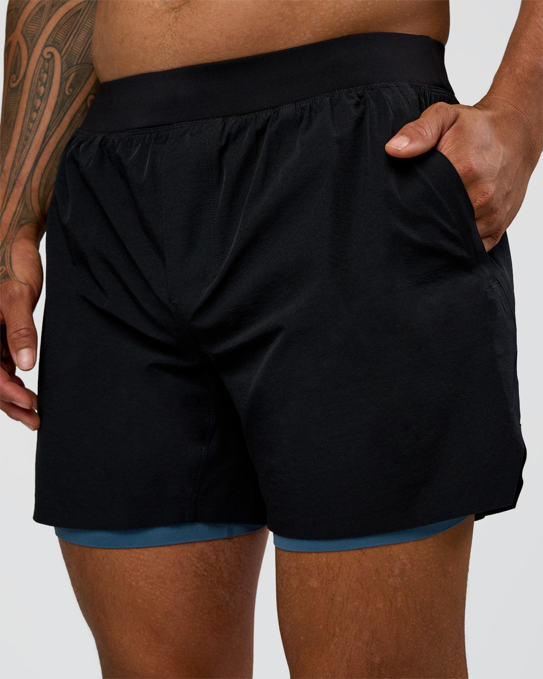 Man wearing Hybrid Lined 5" Short - Black-Indigo | Model:Daarian | Size:M - view 5