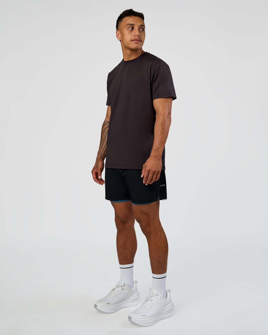 Man wearing Hybrid Lined 5" Short - Black-Indigo | Model:Daarian | Size:M - view 3