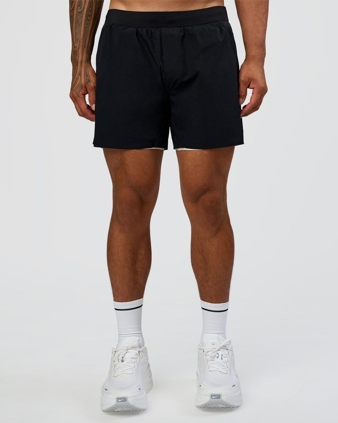 Man wearing Hybrid Lined 5" Short - Black-Shale Beige | Model:Daarian | Size:M - view 9