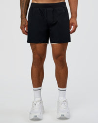 Man wearing Hybrid Lined 5" Short - Black-Shale Beige | Model:Daarian | Size:M | Thumbnail Index: 8