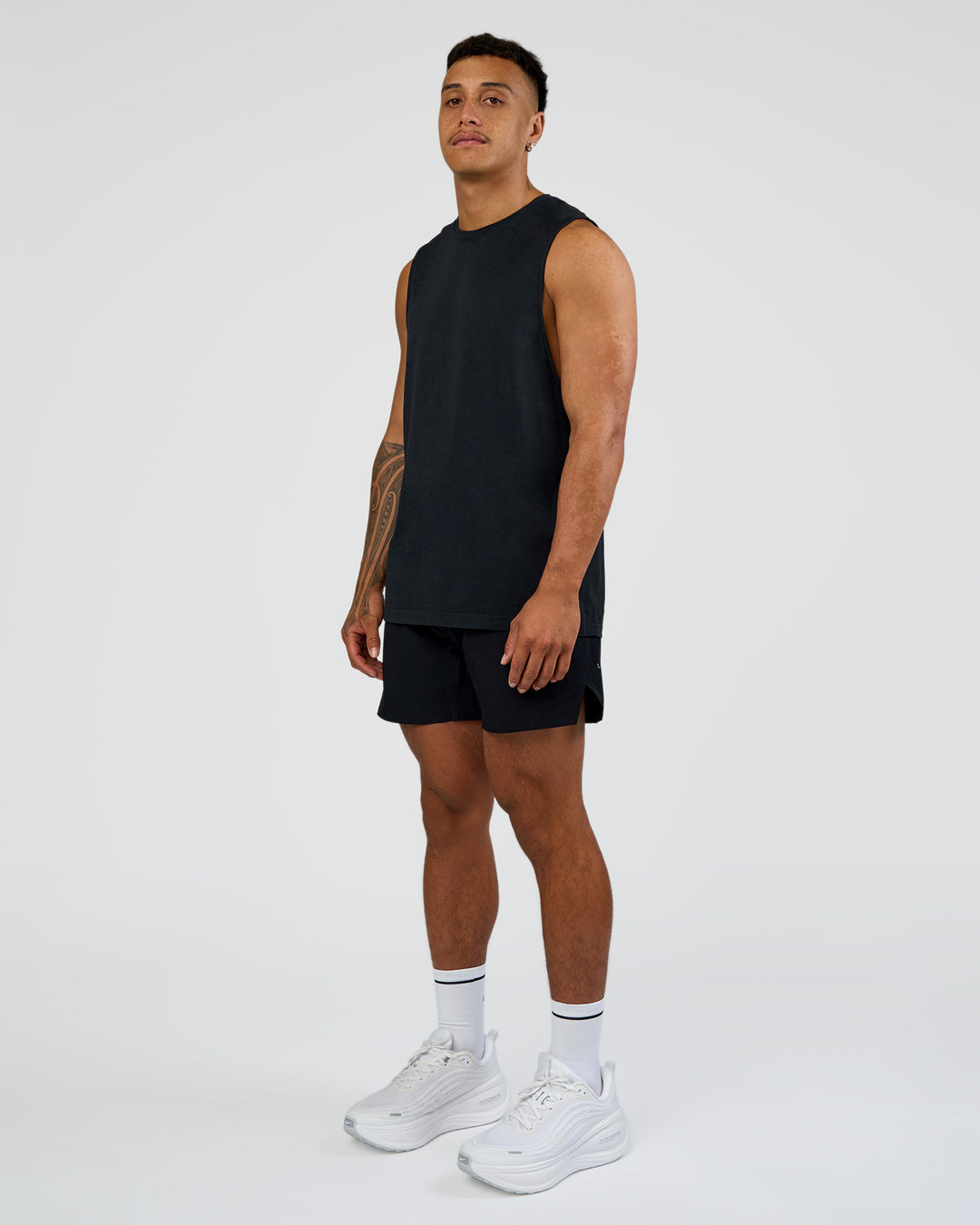 Man wearing Hybrid Lined 5" Short - Black-Shale Beige | Model:Daarian | Size:M - view 7