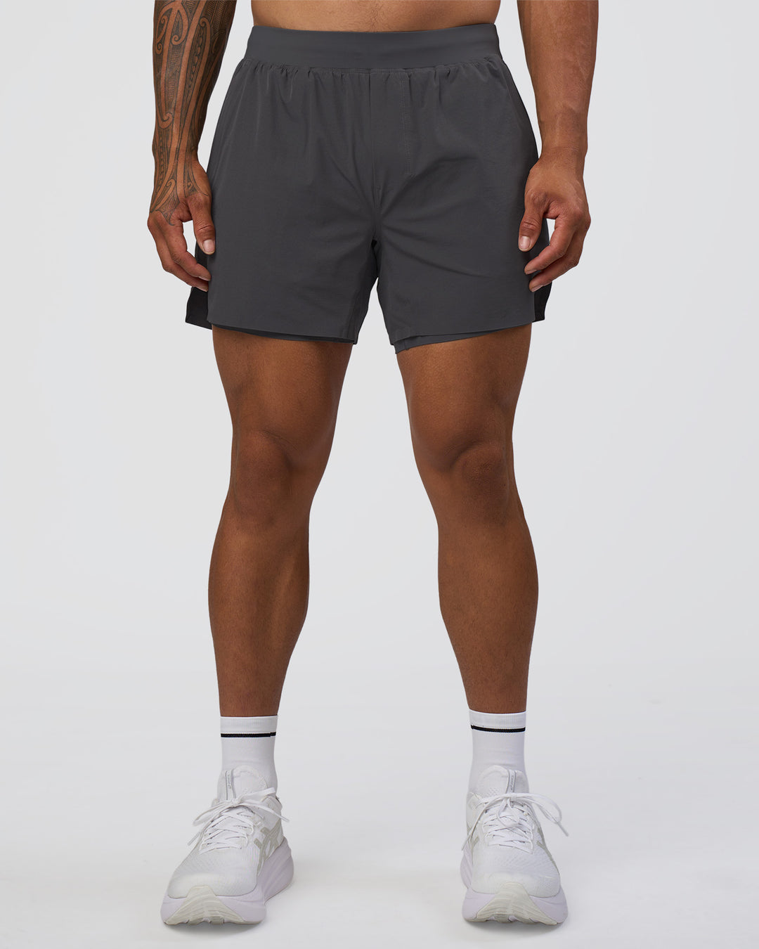Man wearing Hybrid Lined 5" Short - Dark Storm | Model:Daarian | Size:M - view 1
