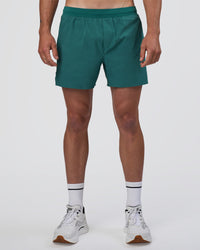 Man wearing Hybrid Lined 5" Short - Transformative Teal | Model:Konnor | Size:M | Thumbnail Index: 0