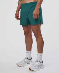 Man wearing Hybrid Lined 5" Short - Transformative Teal | Model:Konnor | Size:M | Thumbnail Index: 8