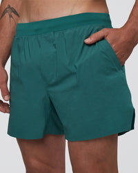 Man wearing Hybrid Lined 5" Short - Transformative Teal | Model:Konnor | Size:M | Thumbnail Index: 5