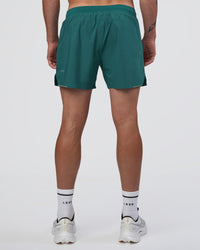 Man wearing Hybrid Lined 5" Short - Transformative Teal | Model:Konnor | Size:M | Thumbnail Index: 3