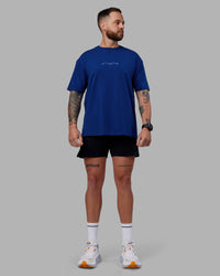 Man wearing Just Run FLXCotton Oversized Tee - Midnight Blue-Light Blue | Model:Macca | Size:M | Thumbnail Index: 8
