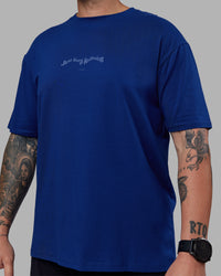 Man wearing Just Run FLXCotton Oversized Tee - Midnight Blue-Light Blue | Model:Macca | Size:M | Thumbnail Index: 7