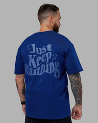 Man wearing Just Run FLXCotton Oversized Tee - Midnight Blue-Light Blue | Model:Macca | Size:M | Thumbnail Index: 9