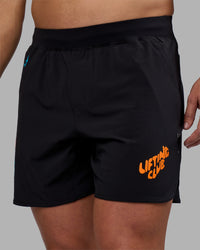 Man wearing Lift 6" Short - Black-Blue Atoll | Model:Jaiden | Size:M | Thumbnail Index: 2