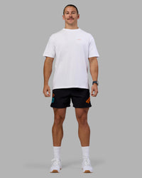 Man wearing Lift 6" Short - Black-Blue Atoll | Model:Jaiden | Size:M | Thumbnail Index: 7