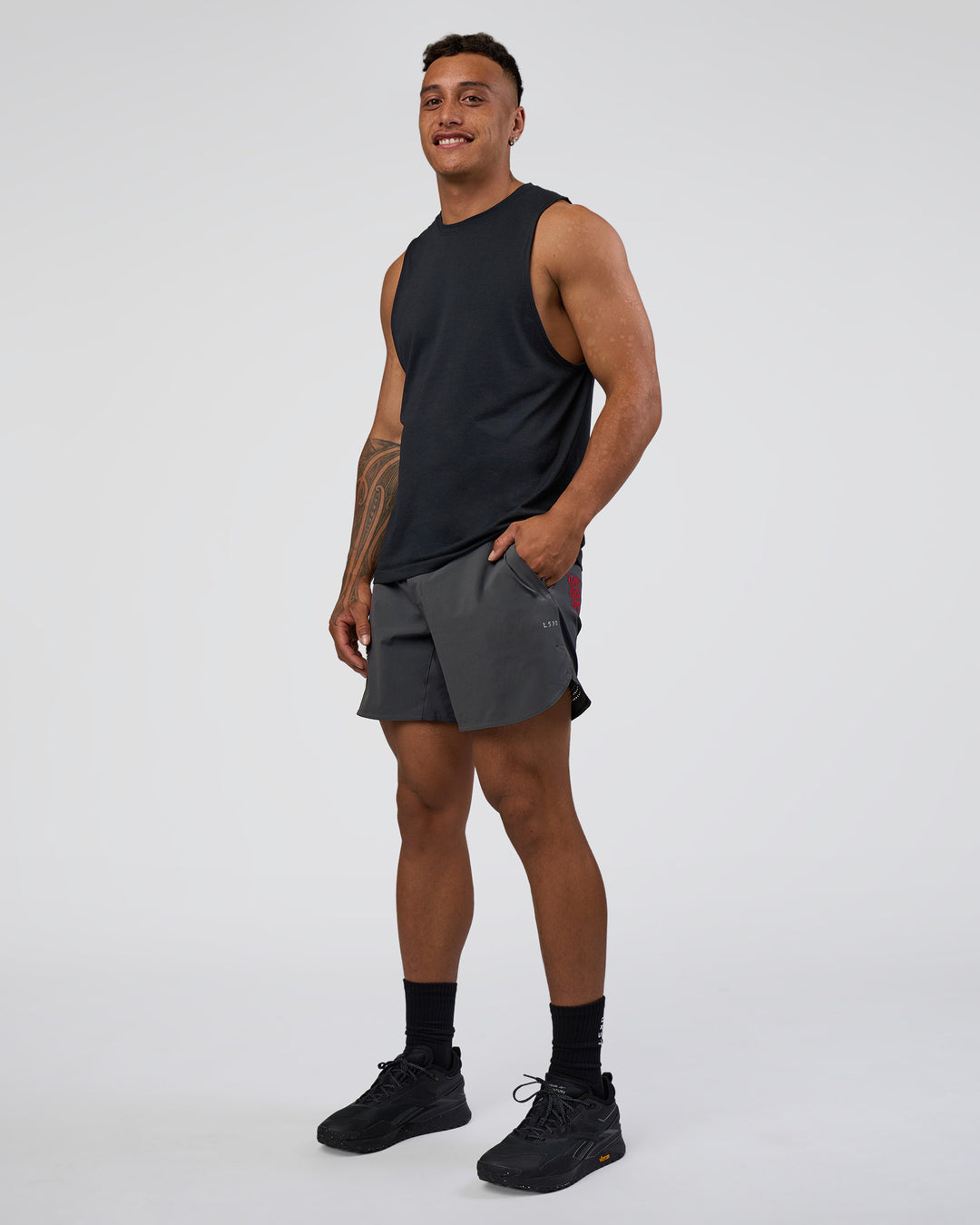 Man wearing Lift 6" Short - Dark Storm-Scarlet | Model:Daarian | Size:M - view 5