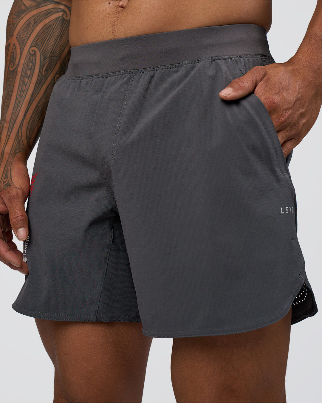 Man wearing Lift 6" Short - Dark Storm-Scarlet | Model:Daarian | Size:M - view 9